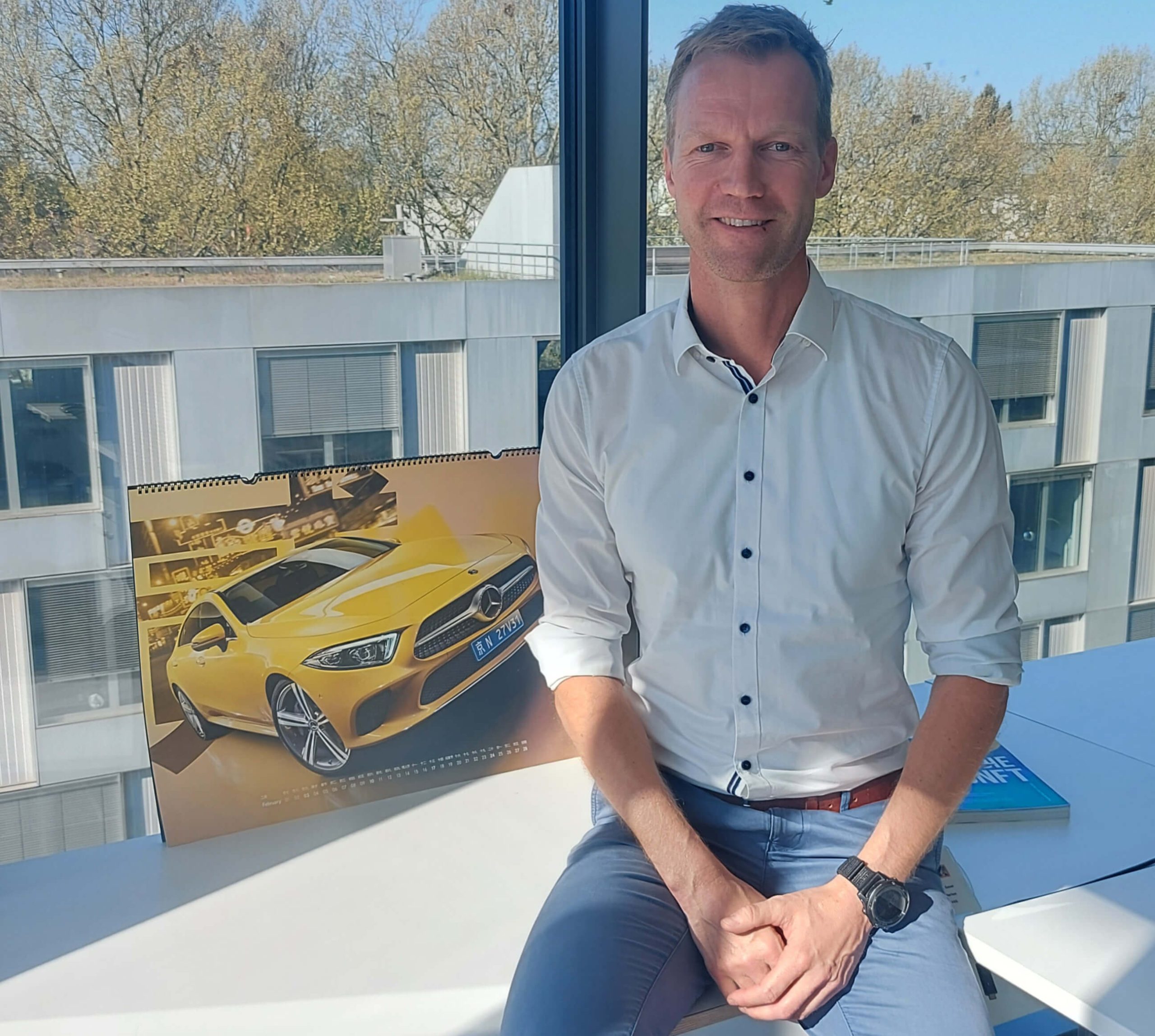 a man sitting on a balcony