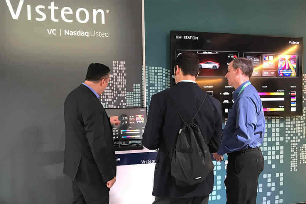 a group of men standing in front of a display