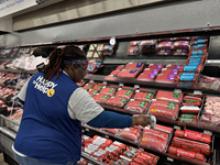Walmart associate scanning products tagged with Avery Dennison RFID-enabled labels.